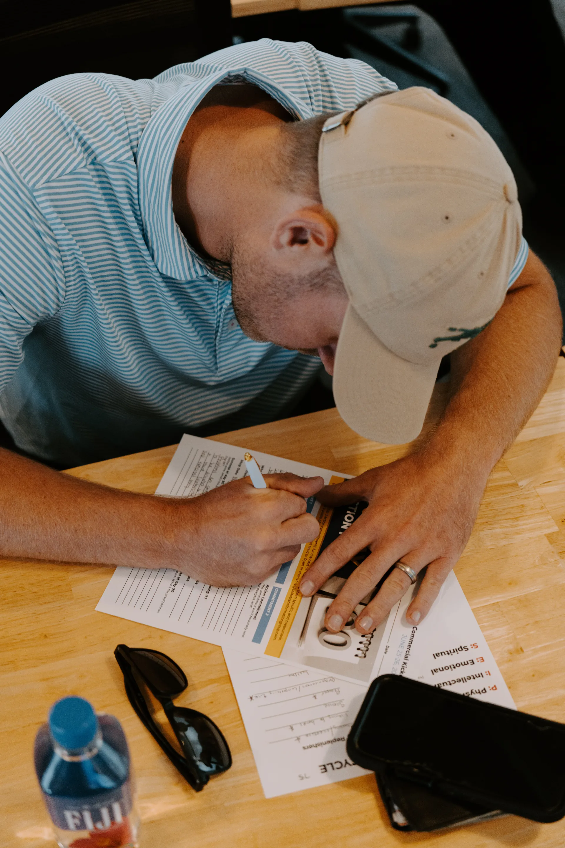 A contractor reviewing sales assessment results on paper